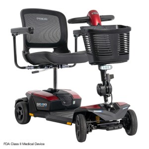 Pride Go Go Endurance AL+ 4-wheel mobility scooter in Garnet Red, front right angle view with mesh seat and front basket