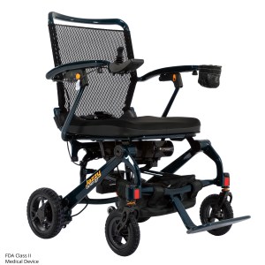 Pride Jazzy Carbon 27 folding power wheelchair in Night Sky, front right angle view showing carbon fiber frame and mesh seat back