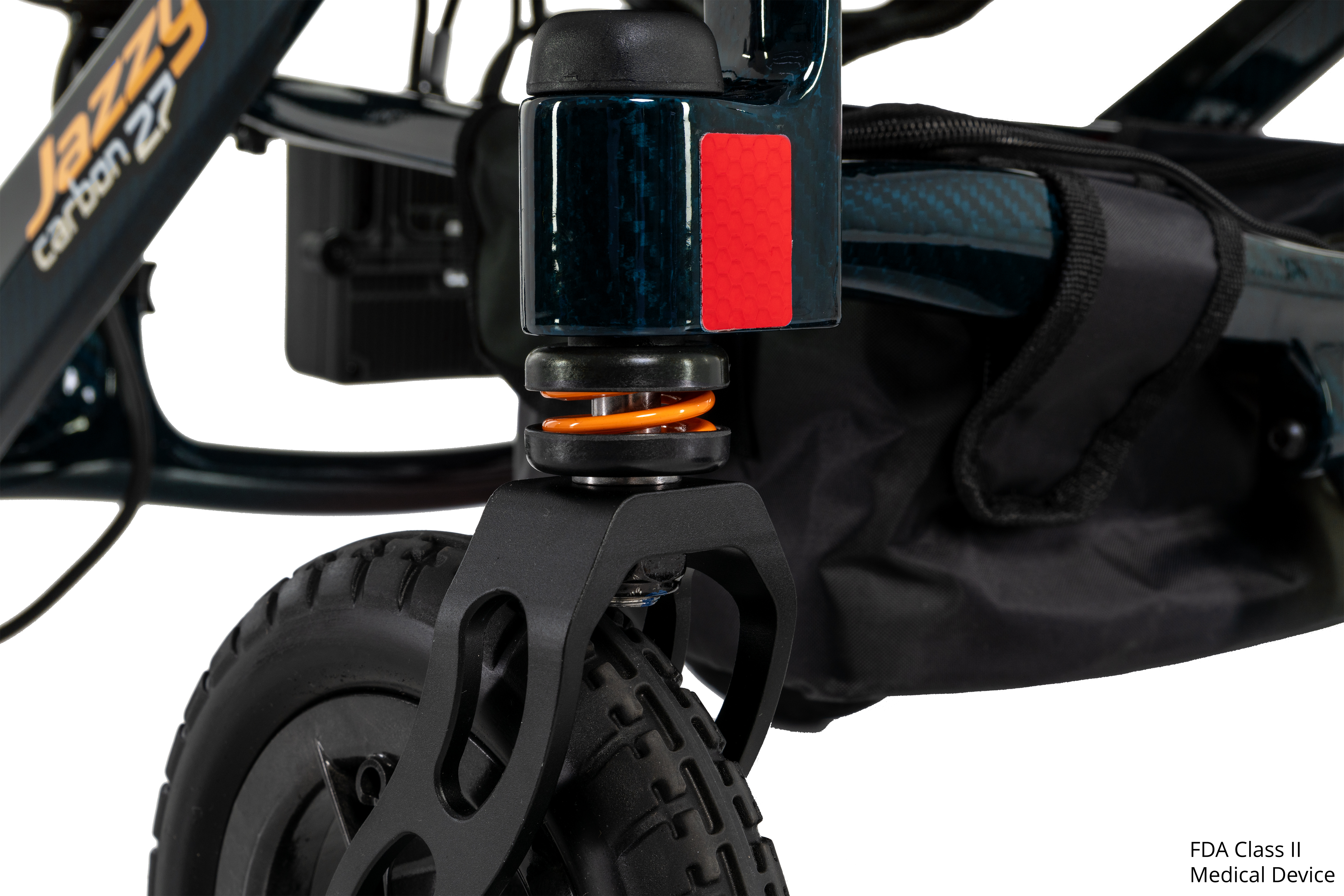 Close-up of the full front suspension on the Pride Jazzy Carbon 27 power wheelchair in Night Sky